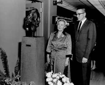 Photograph of Miriam Underhill, Dean of Women,
and Richard L. Judd, senior class president and future CCSU President, admiring the bust of Elihu Burritt 1959