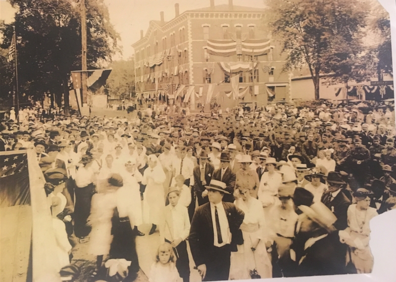 Parade Spectators and Marchers in front of Bradstreet Block.png