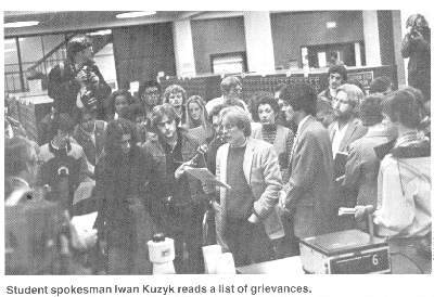 Photograph of student demonstration in the
Circulation area, protesting cuts in library budget. October 13, 1979