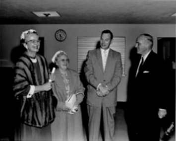 Photographed during the dedication ceremony. Far left,
Mrs. Skinner; unidentified guest; center, Robert Massman, Director of Library Services; far right, Mr. Sherrod Skinner