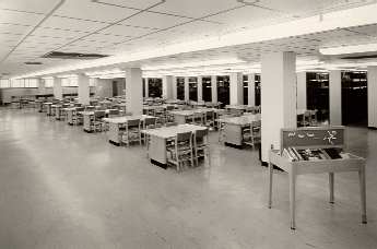 Interior view of the first floor of the new
library, showing periodical shelving and seating, 1960's