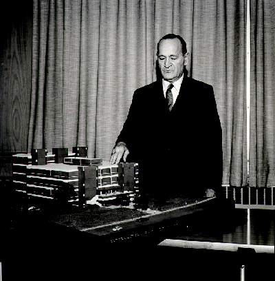 Photograph of President Welte with model of the new
library, about 1968
